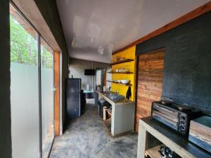 a kitchen with a sink and a counter in a room at Vulture's View 1 in Hartbeespoort