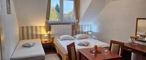 Łóżko lub łóżka w pokoju w obiekcie Letnia willa Jacuzzi & Sauna