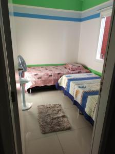 Postel nebo postele na pokoji v ubytování Residencial Gemine