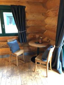 a room with a table and chairs in a log cabin at Seyberth´s Chalet in Siefersheim +51 photos