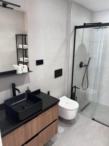 Ένα μπάνιο στο Apartamentos Kouohana +29 φωτογραφίες