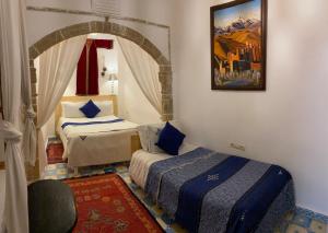 Postel nebo postele na pokoji v ubytování Riad Azul