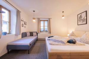 Ένα ή περισσότερα κρεβάτια σε δωμάτιο στο Ferienhaus Dorfschmiede