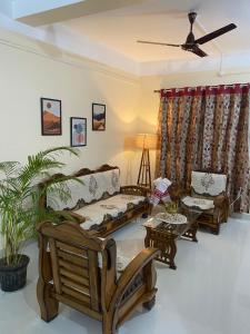 a living room with a couch and a table at Pragati Homes in Guwahati
