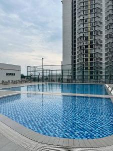 a large swimming pool on top of a building at Zanayra Homestay in Melaka