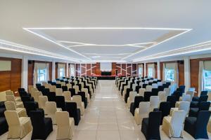 a room with rows of chairs in a building at Sterling Wayanad in Sultan Bathery +37 photos