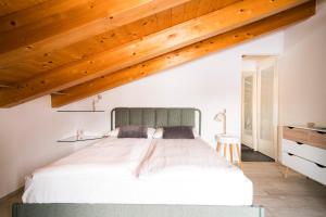 Aosta Holiday Apartments - Gressanにあるベッド