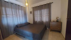 Ένα ή περισσότερα κρεβάτια σε δωμάτιο στο Sunrise Lodge