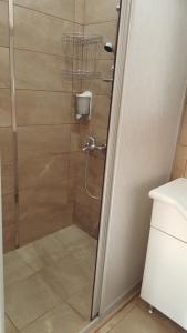 a shower with a glass door in a bathroom at Yeşilköy Airport Hotel in Istanbul +55 photos