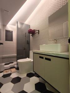 a bathroom with a toilet and a sink at Tu Shu Guan in Guanshan +22 photos