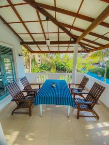a blue table and chairs on a patio at Coco Bliss - Ahangama in Ahangama