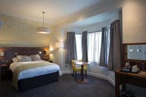 Uma cama ou camas num quarto em The Cross Keys