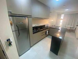Η κουζίνα ή μικρή κουζίνα στο Flat mobiliado ap 25 Campinas - SP