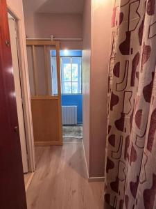 a room with a hallway with a door and a room with a door at Magnifique logement plein centre face aux pistes in Auron
