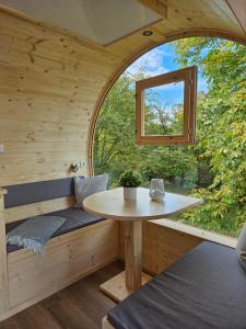 a room with a table and a window at Übernachten im Weinfass in Volkach