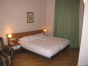Postel nebo postele na pokoji v ubytování Hotel Residence Select