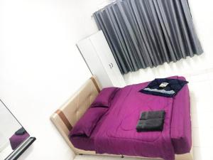 Postel nebo postele na pokoji v ubytování AYUHOMESTAY ii, KUNDANG GAMUDA GARDEN + 1 fotografie