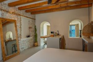 a kitchen with a sink and a refrigerator in a room at Churchill Townhouse in Bodrum City