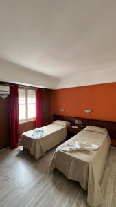 Ένα ή περισσότερα κρεβάτια σε δωμάτιο στο Hotel Flamingo