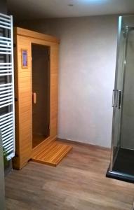 an empty room with a door and a wooden floor at La Maréchalerie L'ATELIER in Lion-en-Sullias +1 photo