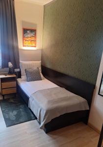 Postel nebo postele na pokoji v ubytování WOB Hotel