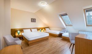 Postel nebo postele na pokoji v ubytování Platan Hotel