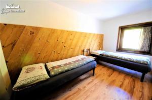 Posteľ alebo postele v izbe v ubytovaní Chalet 1816 by Livigno Accomodation