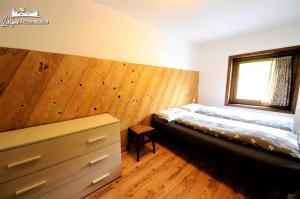 Posteľ alebo postele v izbe v ubytovaní Chalet 1816 by Livigno Accomodation