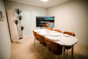 a dining room with a white table and chairs at Gyeongju Record Stay Near tourist attractions in Gyeongju