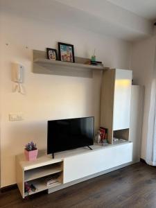 a living room with a flat screen tv on a wall at El relax in La Puebla de Castro