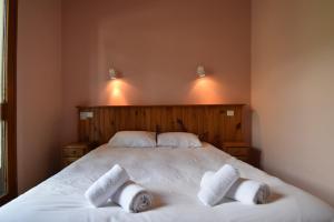 Postel nebo postele na pokoji v ubytování Hôtel Le MontBlanc Flumet
