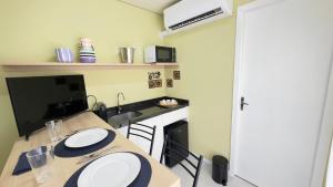 Virtuvė arba virtuvėlė apgyvendinimo įstaigoje Loft Container com Spa