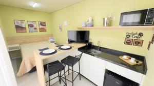 Virtuvė arba virtuvėlė apgyvendinimo įstaigoje Loft Container com Spa