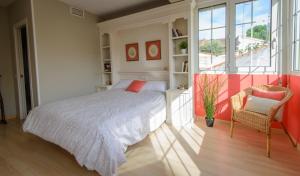 a bedroom with a bed and a large window at Calandria Madrid in Madrid +27 photos