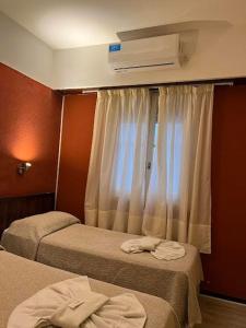 Ένα ή περισσότερα κρεβάτια σε δωμάτιο στο Hotel Flamingo