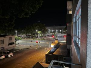 a view of a street at night from a building at Stadium Apartment in Cape Town