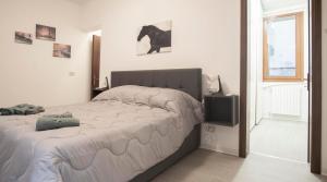 a bedroom with a large bed and a television at Venezia 1851 in Venice