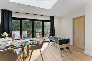 a living room with a table with a foosball at Amazing Rural Retreat in The Cotswolds - Parking in Frome