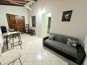a living room with a couch and a table at Departamento Batti in Asuncion