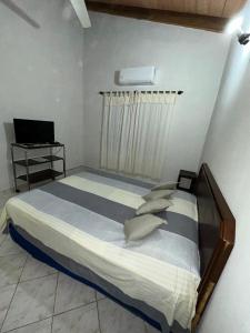 Postel nebo postele na pokoji v ubytování Departamento Batti