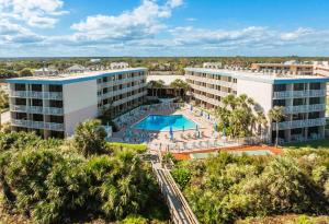 an aerial view of a resort with a swimming pool at The Beach Club St Augustine by Coolvacay in Saint Augustine Beach