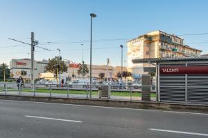 a bus stop on the side of a city street at Crystal House - Nido Verde in Florence