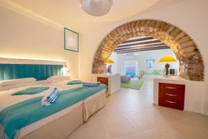 Ένα ή περισσότερα κρεβάτια σε δωμάτιο στο Piccolo Grand Hotel