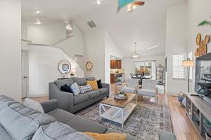 a living room with a couch and a table at Chill & Grill Firepit, Bbq, 70 Tv, Near Topgolf in Meridian