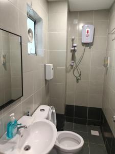 a bathroom with a sink and a toilet at Dream 6 Emerald avenue in Cameron Highlands +14 photos