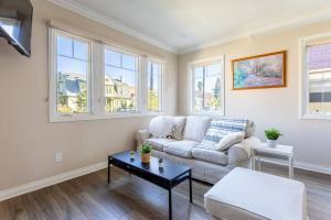 a living room with a couch and a table at Getaway 4BR Home in the Heart of LA in Los Angeles