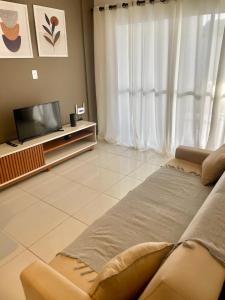 TV a/nebo společenská místnost v ubytování Casa Com Piscina em Jacumã e Carapibus