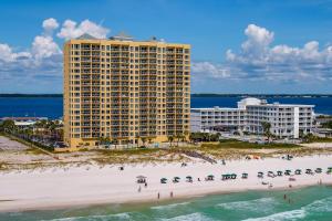 a view of a beach with a large building at Emerald Isle Gulf Front 3B Condo - 1208 in Pensacola Beach