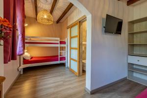 Letto o letti in una camera di L'Interlude