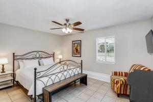 a bedroom with a bed and a ceiling fan at Stay Exceptional - 3B Beach Home in Pensacola Beach +28 photos
